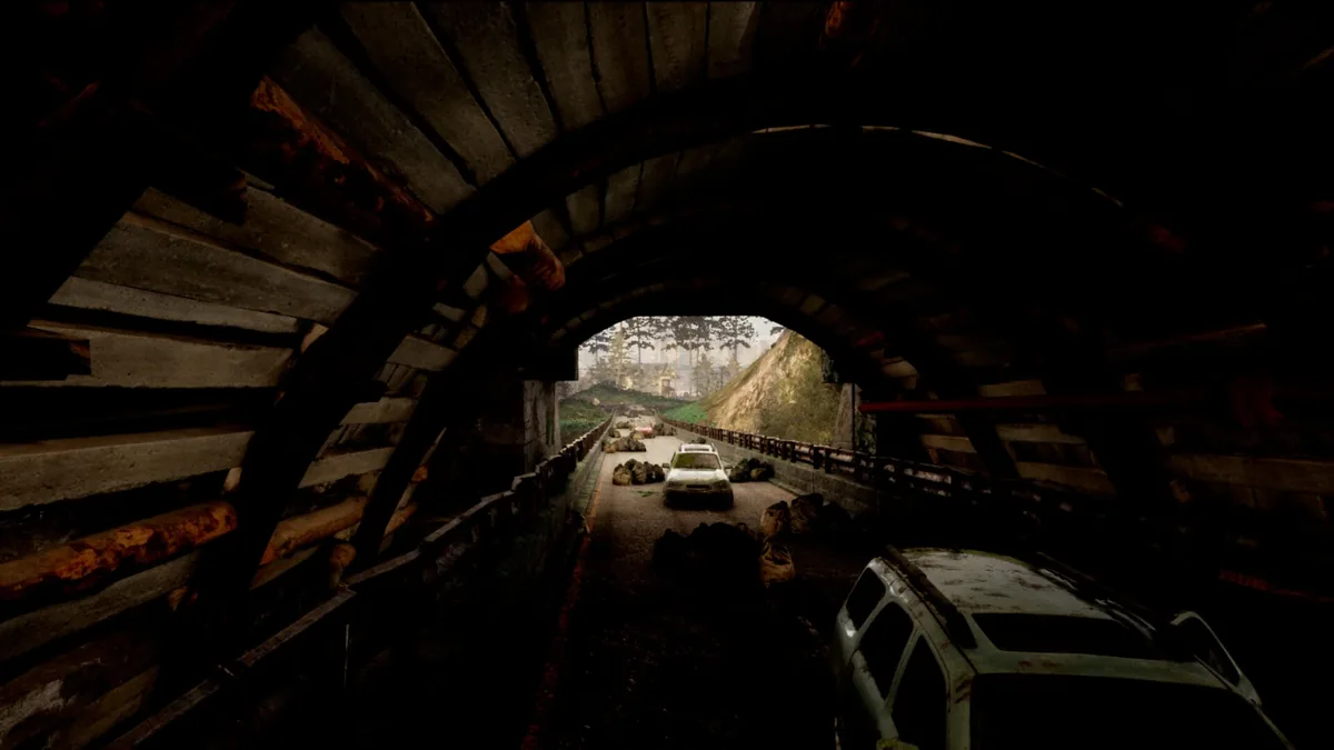 DeadLived in-game screenshot — abandoned cars inside a collapsed road tunnel